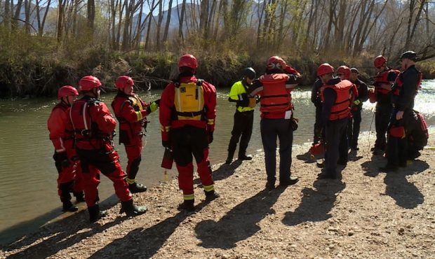 Fire fighters gather before swift water rescue training begins in the Weber River. (Mike Anderson, ...