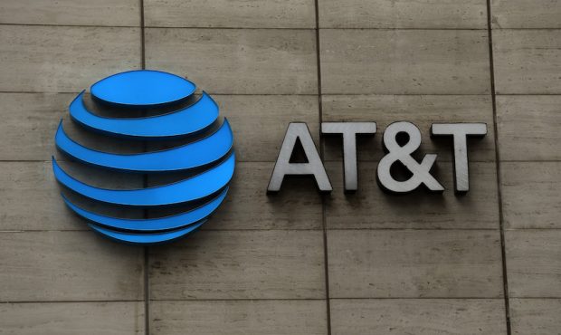 FILE: The AT&T logo outside of AT&T corporate headquarters on March 13, 2020, in Dallas, Texas. (Ph...