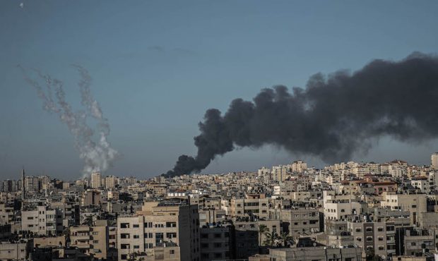 A picture showing a local fire north of Gaza City, along with rockets fired from Gaza to Israel on ...