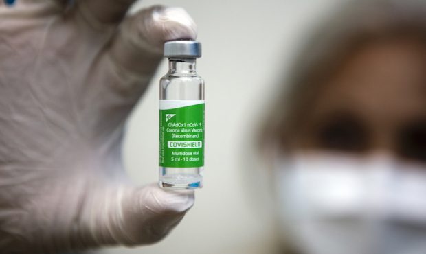 FILE: Health personnel displays a vial containing a dose of the Covishield vaccine (Oxford-AstraZen...