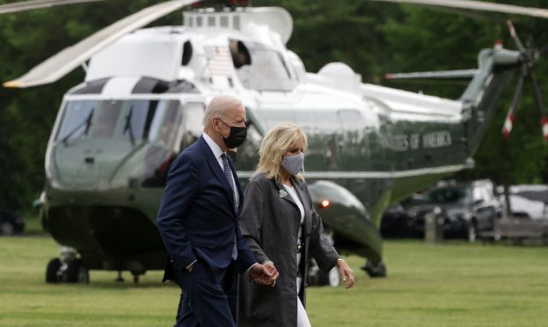 President Joe Biden and first lady Jill Biden walk towards the motorcade after the Marine One lande...