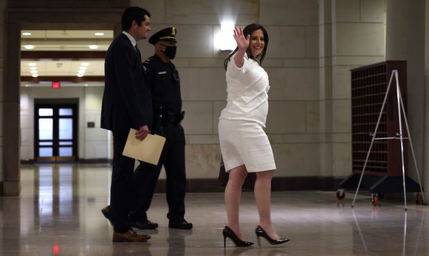 Rep. Elise Stefanik (R-NY) waves as she arrives at a caucus meeting where Republican members will v...