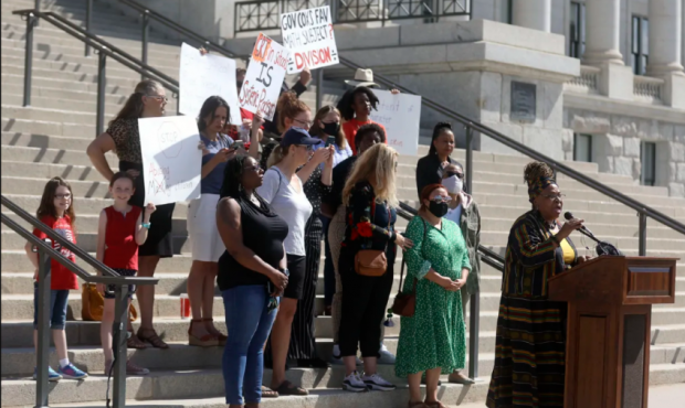 Betty Sawyer joins educators and community activists in protesting Utah lawmakers’ plans to pass ...