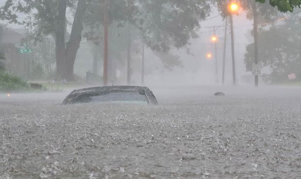 A car is nearly submerged in floodwaters in Lake Charles, Louisiana, on May 17, 2021. (Courtesy Der...