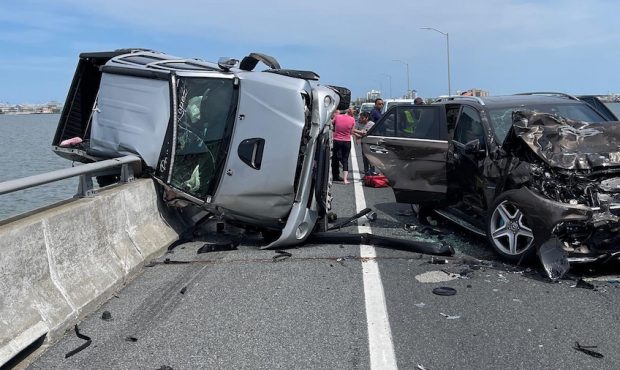 At least eight people were taken to hospitals May 2 after a crash that left a car dangling off the ...