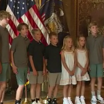 Governor Cox with Jenn Drummond and her seven children. (KSL TV)