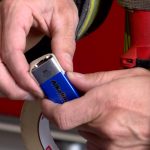 Firefighter Patrick Costin with the Unified Fire Authority says 9-volt batteries should be stored with a piece of tape covering the two terminals. (KSL TV)