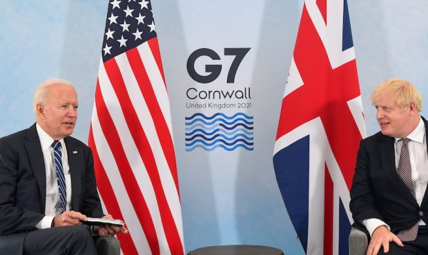U.S. President Joe Biden speaks with Britain's Prime Minister Boris Johnson during their meeting, a...