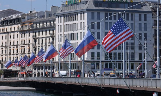 FILE: Russian and American flags fly on a bridge in the city center prior to a meeting between U.S....