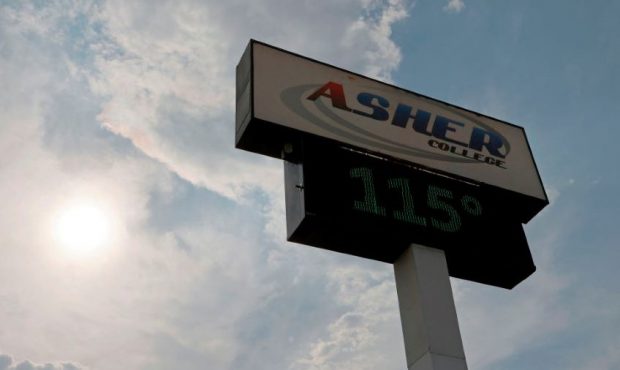 LAS VEGAS, NEVADA - JUNE 17: A digital sign displays a temperature of 115 degrees Fahrenheit as a h...
