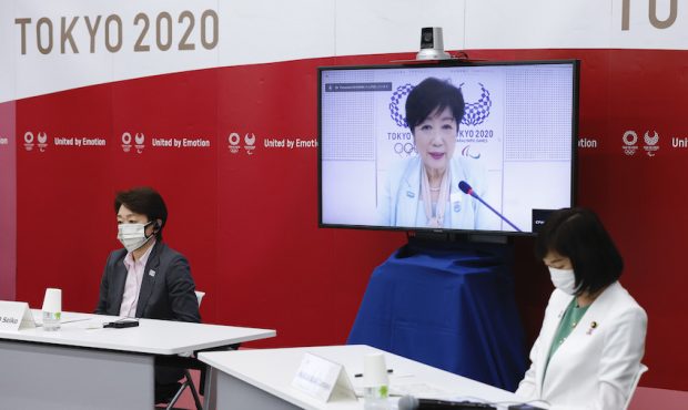 (L-R) Seiko Hashimoto, President of Tokyo 2020, Tokyo Governor Yuriko Koike (on a screen) and Tamay...