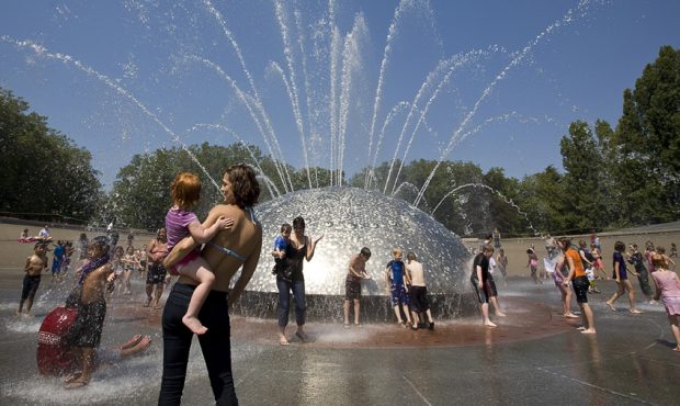 SEATTLE - JULY 29:  Locals and visitors cool off in the International Fountain at the Seattle Cente...
