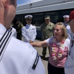 Theodore Jensen’s niece thanks members of the U.S. Navy for being at the SLC Airport to welcome her uncle home. (Alex Cabrero/KSL TV)