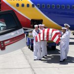 Members of the U.S. Navy carry Theodore Jensen’s remains to the hearse to bring him home to Delta. (Alex Cabrero/KSL TV)