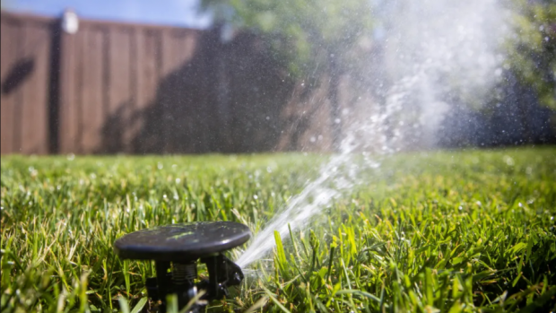 Sprinklers water a lawn in Salt Lake City on Friday, May 7, 2021. Utah Gov. Spencer Cox issues his third water restriction in four months. Spenser Heaps, Deseret News