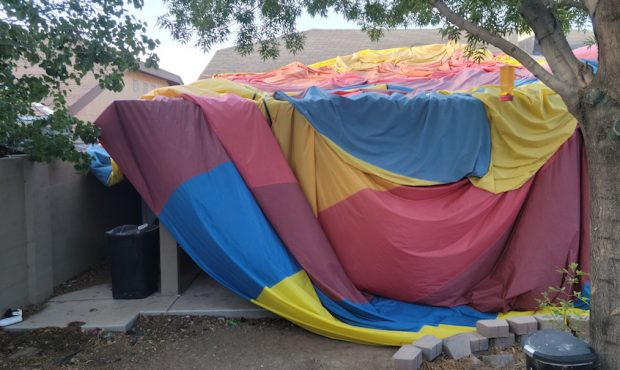 Austin Council took this photo of the envelop of a hot air balloon that is covering a neighbor's ho...