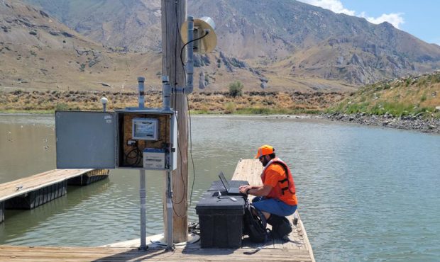 USGS hydrologic technician Travis Gibson confirms Great Salt Lake water levels at the SaltAire gaug...