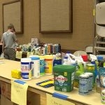 Flood Victims Pick Up Cleaning Supplies