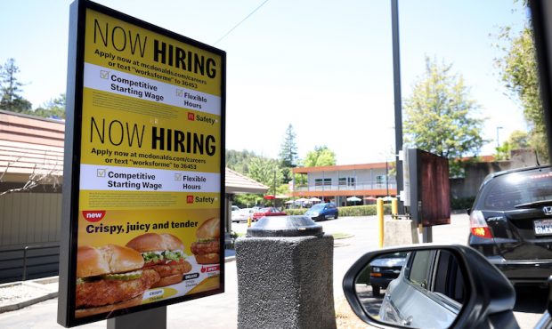 A "Now Hiring" sign is posted in the drive thru of a McDonald's restaurant on July 07, 2021 in San ...