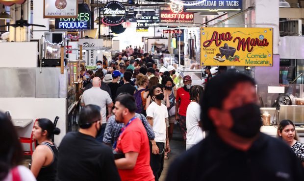People gather in Grand Central Market on July 19, 2021 in Los Angeles, California. A new mask manda...