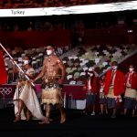 Flag bearers Malia Paseka and Pita Taufatofua of Team Tonga lead their team out during the Opening Ceremony of the Tokyo 2020 Olympic Games at Olympic Stadium on July 23, 2021 in Tokyo, Japan. (Photo by Jamie Squire/Getty Images)
