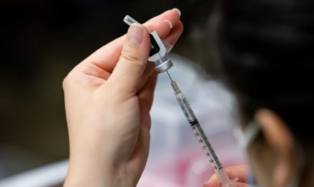 Nurse Estefania Cruz fills a syringe with a dose of the Pfizer-BioNTech COVID-19 vaccine at the Cen...