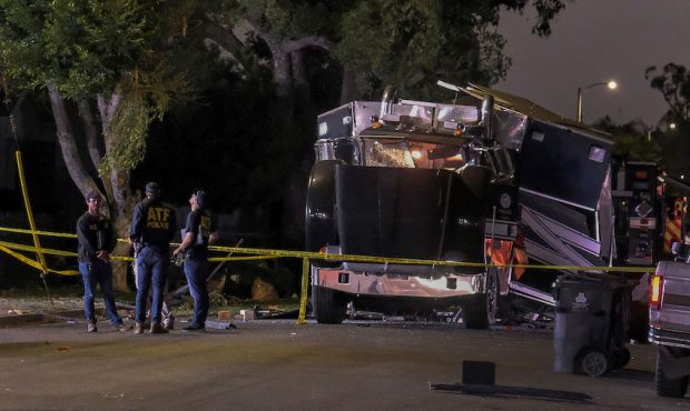 The remains of an armored Los Angeles Police Department tractor-trailer are seen after fireworks ex...