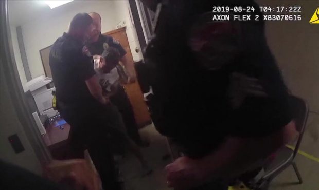This still from body camera from Aug. 22, 2019, shows officers and Chad Breinholt stuggling in the ...