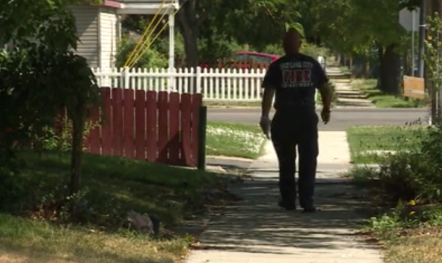 A firefighter drops off fireworks education flyers in the Rose Park Neighborhood. (KSL TV)...
