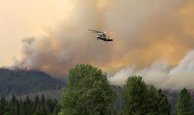 A helicopter flies near the Dixie Fire in California. (U.S. Forest Service)...