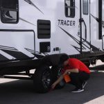General RV’s Zac Andersen preps a camper on his lot before unhooking it from the truck. (Ken Fall/KSL TV)