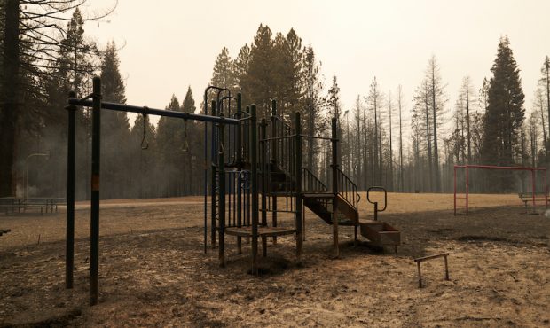 A partially burnt playground still smolders at Walt Tyler Elementary School on August 18, 2021 in G...