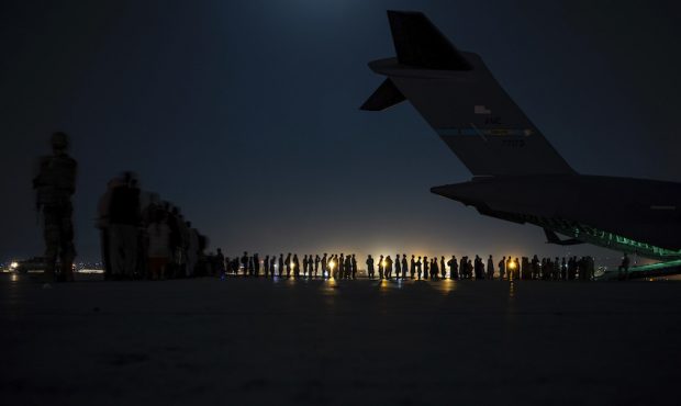 A U.S. Air Force aircrew, assigned to the 816th Expeditionary Airlift Squadron, prepare to load qua...