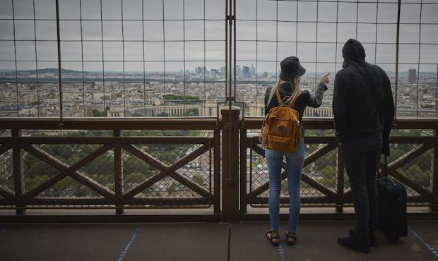 Visitors admire the view of Paris as the Eiffel Tower reopened for the first time in over 8 months ...