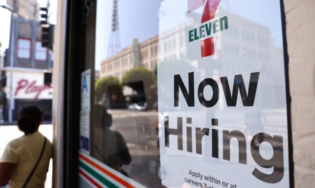 A 'Now Hiring' sign is posted at a 7-Eleven store on Aug. 06, 2021, in Los Angeles, California. (Ph...