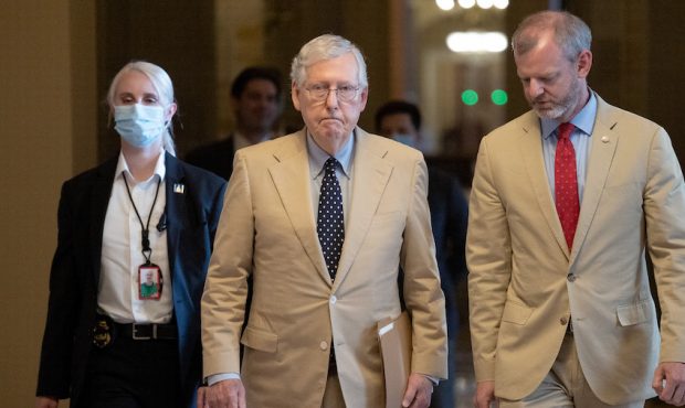 Senate Minority Leader Mitch McConnell (R-KY) walks to the U.S. Senate chamber with Robert Duncan (...