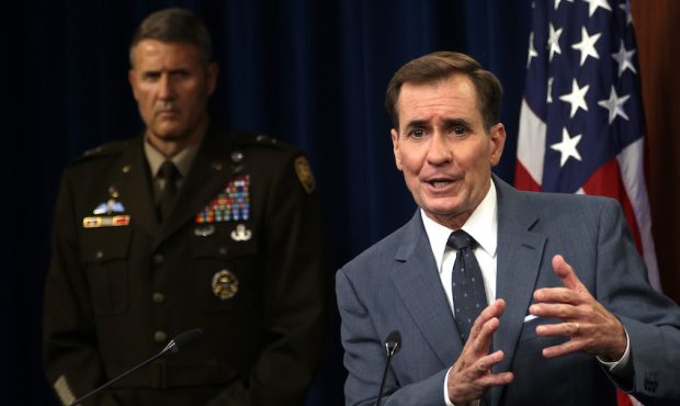 U.S. Department of Defense Press Secretary John Kirby (R) speaks as Army Major General William Tayl...