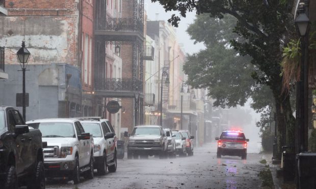 A police car cruises through the French Quarter during Hurricane Ida on August 29, 2021 in New Orle...