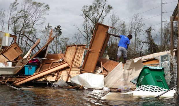 Alonzo Lewis rescues items from his mother's home after it was destroyed by Hurricane Ida on August...