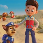 Foreground: Chase (voiced by Iain Armitage) and Ryder (voiced by Will Brisbin). Background L-R: Skye (voiced by Lilly Bartlam), Rocky (voiced by Callum Shoniker), Rubble (voiced by Keegan Hedley), Zuma (voiced by Shayle Simons), and Marshall (voiced by Kingsley Marshall) in PAW PATROL: THE MOVIE from Paramount Pictures. Photo Credit: Courtesy of Spin Master.