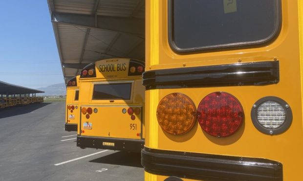 FILE PHOTO -- School buses sit at an Alpine School District depot on Aug. 12, 2021. (Ashton Goodell...