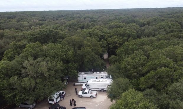 Law enforcement officials conduct a search of the vast Carlton Reserve in the Sarasota, Florida, ar...