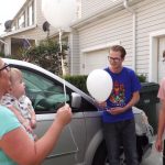 Summer Smart holds her one-year-old grandson, Greyson Mair, while she and her family released balloons on her late son’s birthday. (Josh Szymanik/KSL TV)