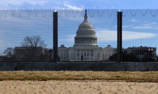 FILE: A temporary security fence topped with concertina razor wire surrounds the U.S. Capitol on Fe...