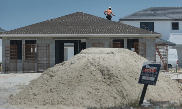 FILE: A construction worker builds a home on April 16, 2021 in Miami, Florida. (Photo by Joe Raedle...