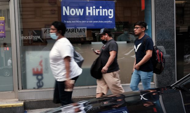 FILE: A hiring sign is displayed in a store window in Manhattan on August 19, 2021 in New York City...
