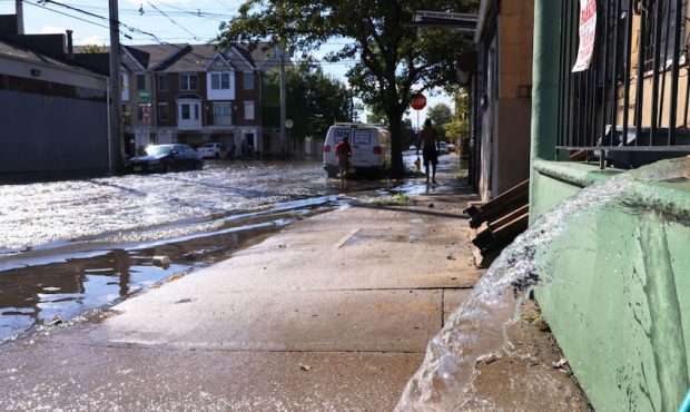Water is pumped out of the basement of a home on Clifford Street on September 02, 2021 in Newark, N...