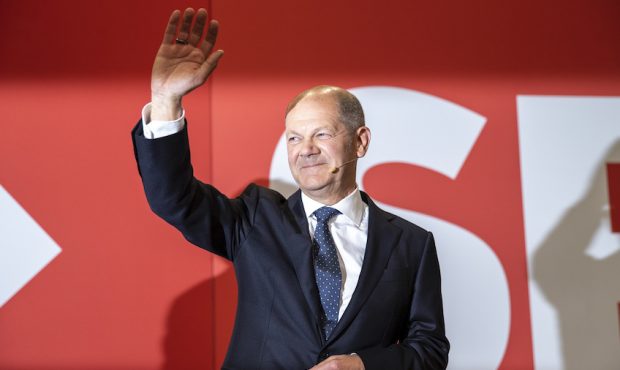 Olaf Scholz, chancellor candidate of the German Social Democrats (SPD), waves to supporters in reac...