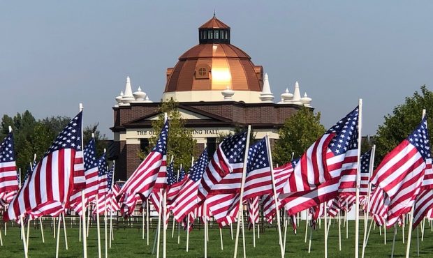 A large number of American flags, honoring the victims of the Sept. 11 terrorist attacks, are on di...