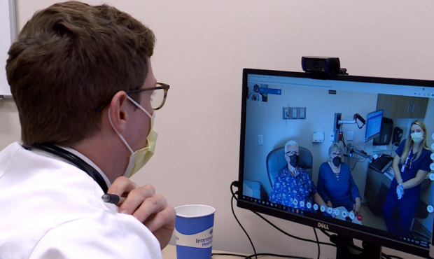 Dr. David Gill, an oncologist with Intermountain Healthcare, uses TeleHealth to visit with his pati...